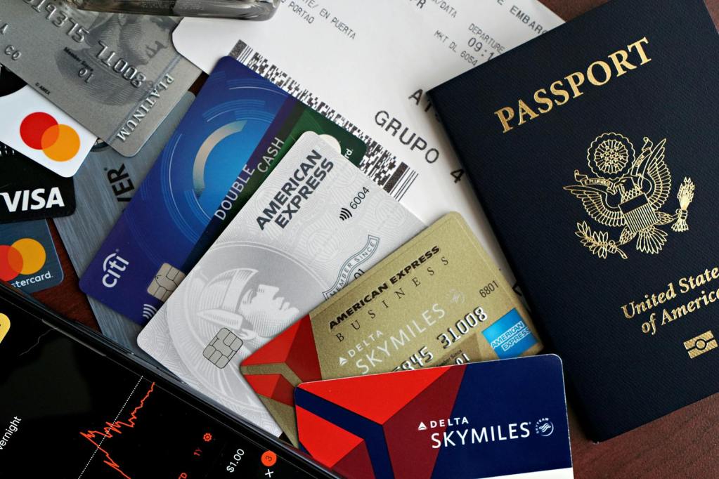 travel essentials passport credit cards and boarding pass